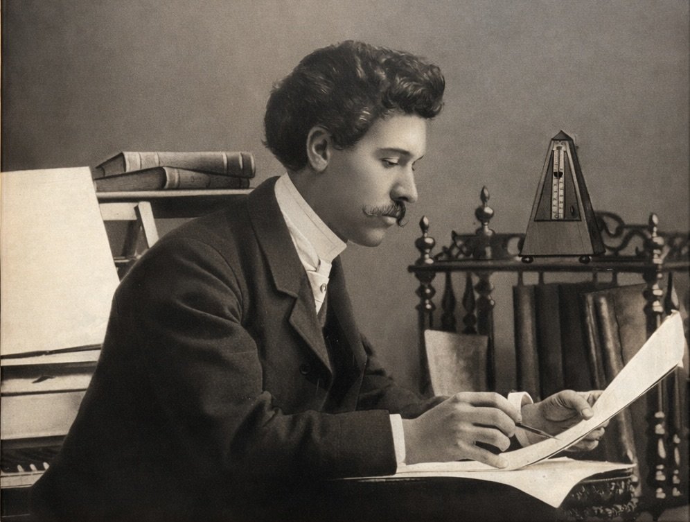 Albert Dupuis composing at his desk